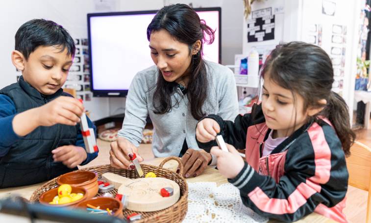Teacher guiding kids